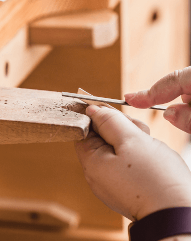 filing-wood-on-a-work-bench 1
